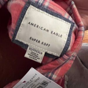 brand new men’s xs flannel, red white plaid never worn tags still on it